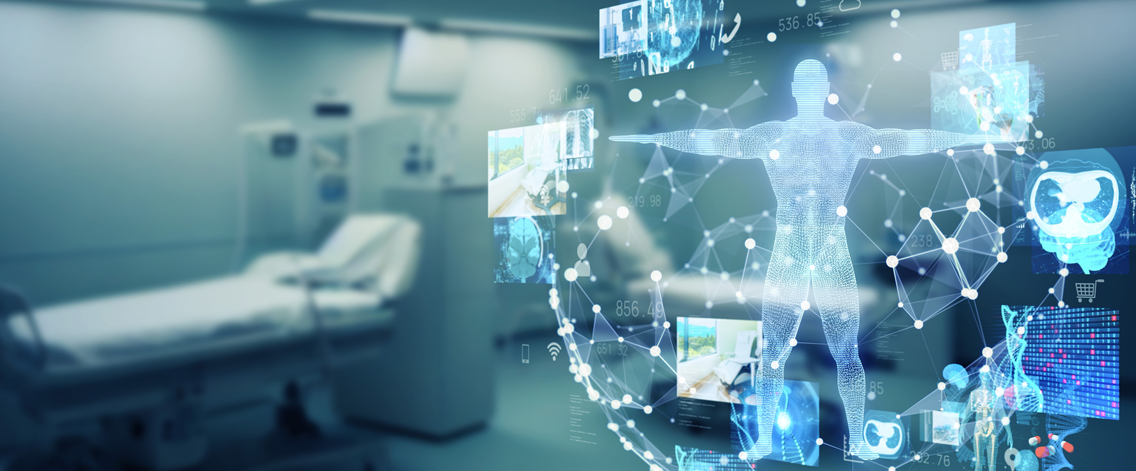 In einem Krankenhauszimmer sieht man die digitale Darstellung eines Körpers mit Behandlungsmethoden.